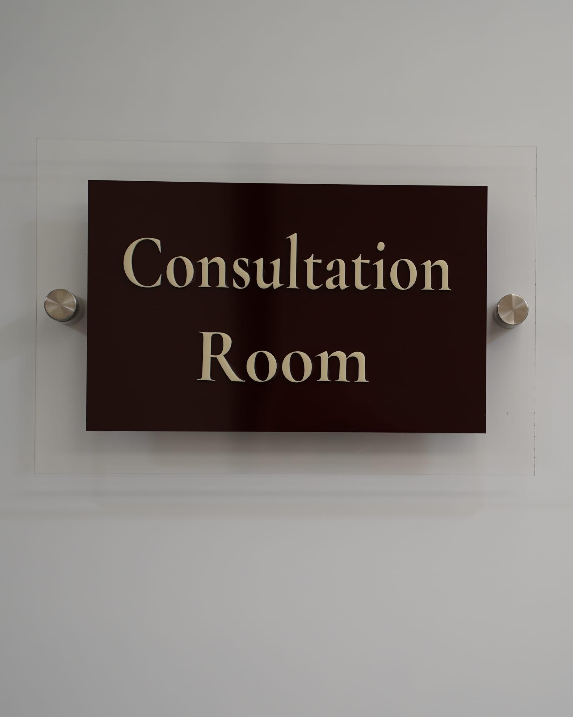 Consultation Room door sign at Le Dermato